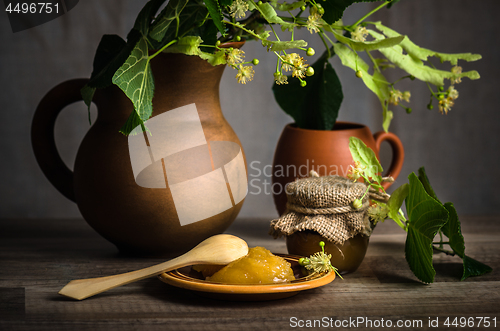 Image of Jar with white honey on the table,\rclose-up