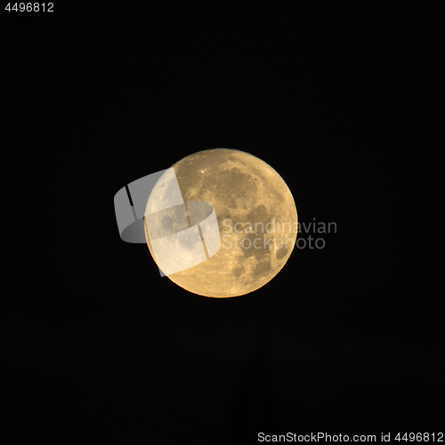 Image of Rising Cold Moon on Black Background Square Crop