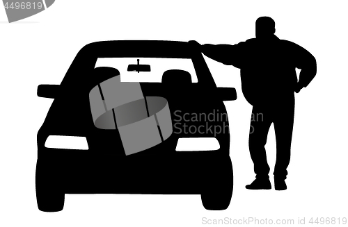 Image of Man standing next to the car