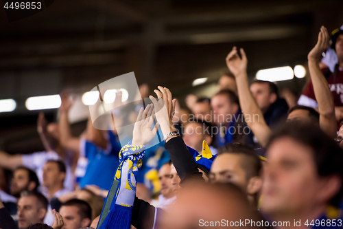 Image of soccer fans hands clapping while supporting their team