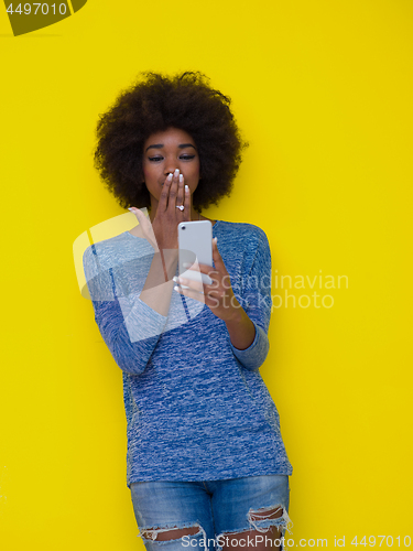 Image of young black Woman Using mobile phone