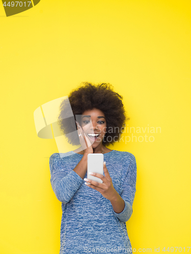 Image of young black Woman Using mobile phone