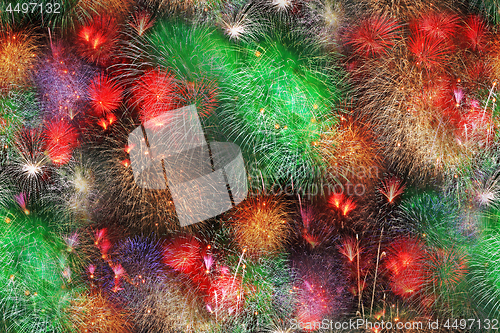 Image of Big fireworks in the night summer sky as a seamless background