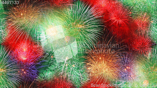 Image of Big fireworks in the night summer sky as a seamless background