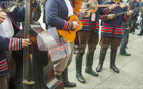 Image of Croatian musicians in traditional Slavonian costumes