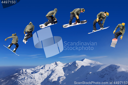 Image of Snowboarding Snowboard Snowboarder at jump mountains at sunny da