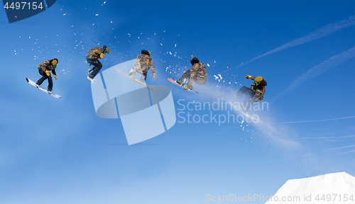 Image of Snowboarding Snowboard Snowboarder at jump mountains at sunny da