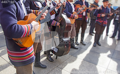 Image of Traditional Croatian musicians in Slavonian costumes play in the