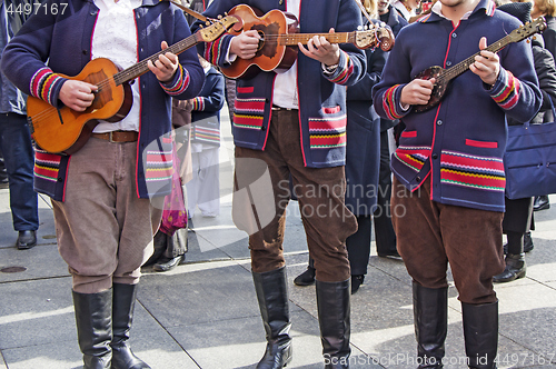 Image of Traditional Croatian musicians in Slavonian costumes play in the