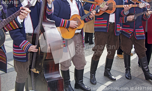 Image of Traditional Croatian musicians in Slavonian costumes play in the