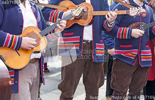 Image of Traditional Croatian musicians in Slavonian costumes play in the