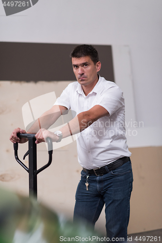 Image of designer in his furniture manufacturing workshop