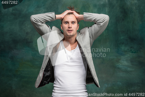 Image of The young attractive man looking suprised