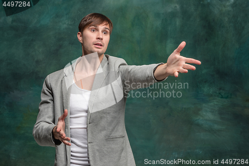 Image of Isolated on pink young casual man shouting at studio