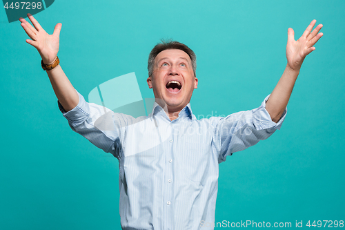 Image of Winning success man happy ecstatic celebrating being a winner. Dynamic energetic image of male model