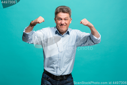 Image of Winning success man happy ecstatic celebrating being a winner. Dynamic energetic image of male model