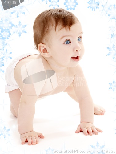 Image of crawling baby boy looking up