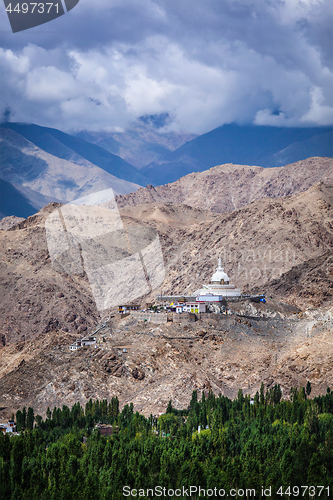 Image of  Buddhist stupa chorten on a hilltop in Himalayas