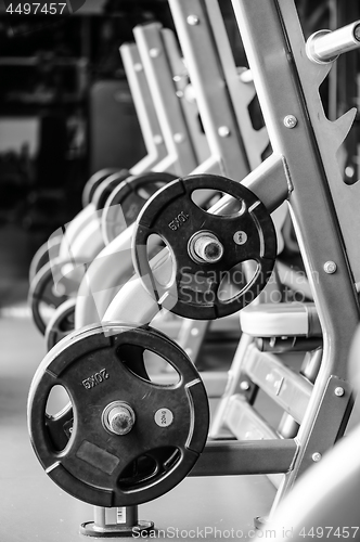 Image of Modern gym interior with bench press equipment in a raw