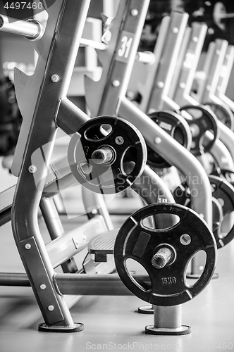 Image of Modern gym interior with bench press equipment in a raw