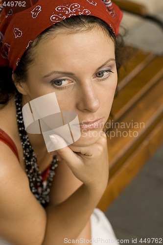 Image of unhappy woman in red kerchief