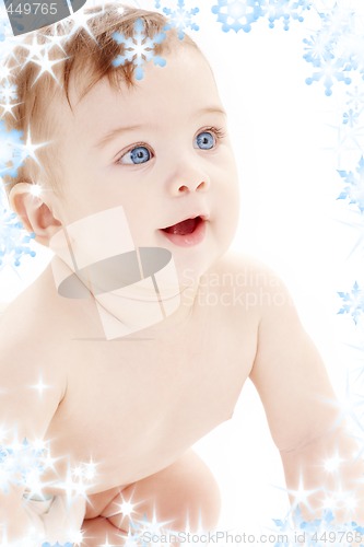 Image of portrait of crawling baby boy looking up