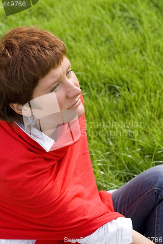 Image of woman sitting on the grass