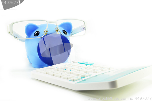 Image of Piggy bank with eye glasses and calculator