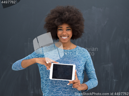 Image of Happy African American Woman Using Digital Tablet