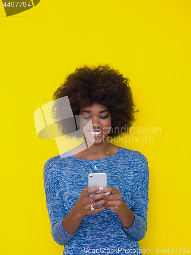 Image of young black Woman Using mobile phone