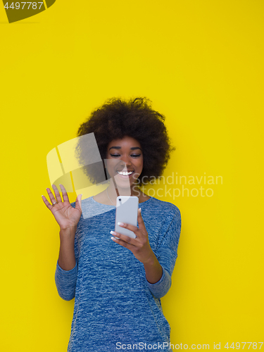 Image of young black Woman Using mobile phone