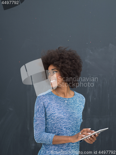 Image of Happy African American Woman Using Digital Tablet