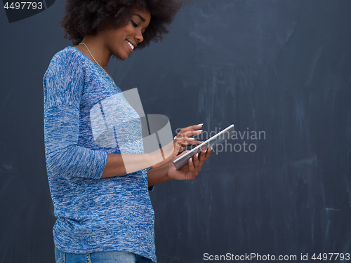 Image of Happy African American Woman Using Digital Tablet