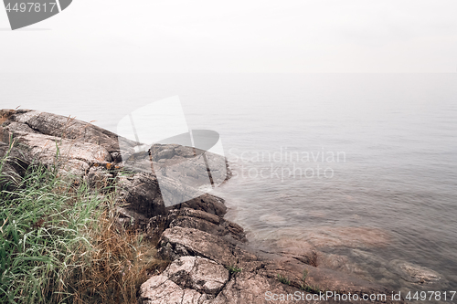 Image of Rocky coast and smooth water