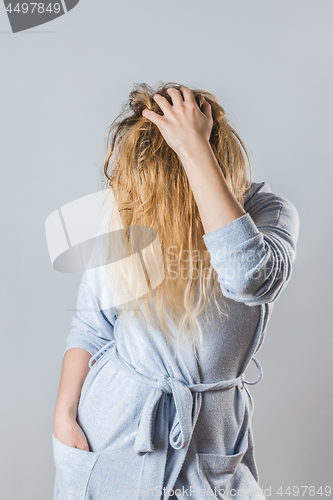 Image of Young woman with washed wet hair