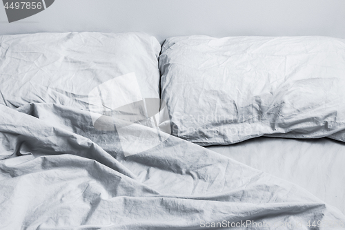 Image of Messy gray bed linen