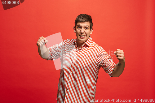 Image of Winning success man happy ecstatic celebrating being a winner. Dynamic energetic image of male model