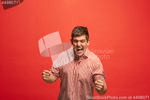 Image of Winning success man happy ecstatic celebrating being a winner. Dynamic energetic image of male model