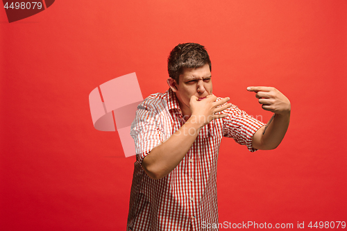 Image of Isolated on green young casual man shouting at studio