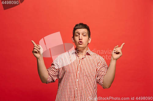 Image of Winning success man happy ecstatic celebrating being a winner. Dynamic energetic image of male model