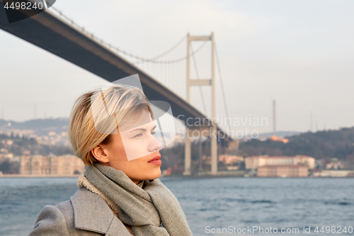 Image of Portrait of a young woman under the Bosporus bridge.