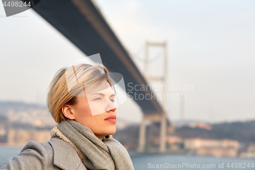 Image of Portrait of a young woman under the Bosporus bridge.