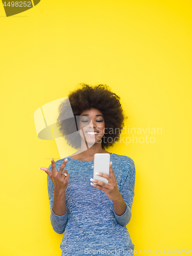 Image of young black Woman Using mobile phone