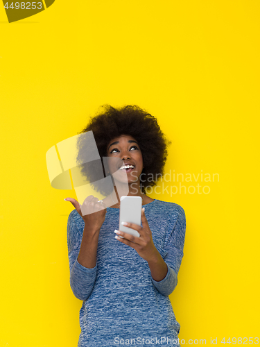 Image of young black Woman Using mobile phone