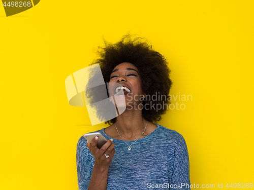 Image of young black Woman Using mobile phone