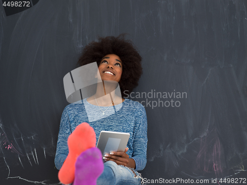 Image of Happy African American Woman Using Digital Tablet