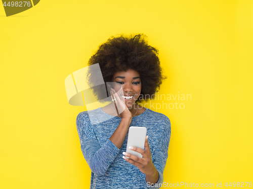 Image of young black Woman Using mobile phone