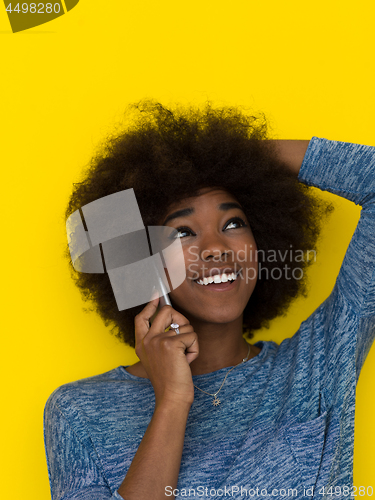 Image of young black Woman Using mobile phone