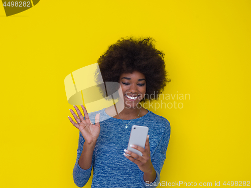 Image of young black Woman Using mobile phone