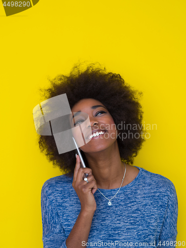 Image of young black Woman Using mobile phone